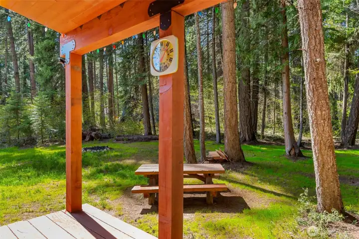 Peaceful, park-like setting with a covered gathering area and picnic space