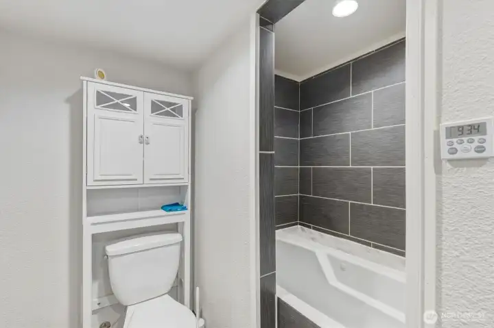 Downstairs Bathroom with Jetted Tub and Shower