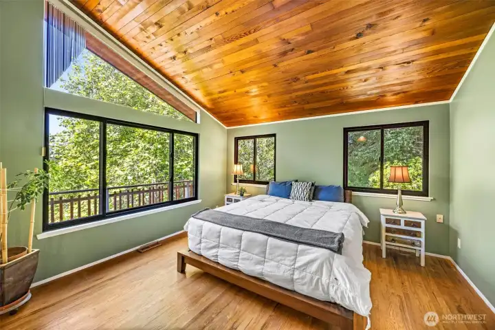 Primary sweet with sliding glass door to private deck