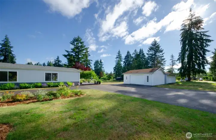 Paved parking area and Two garages