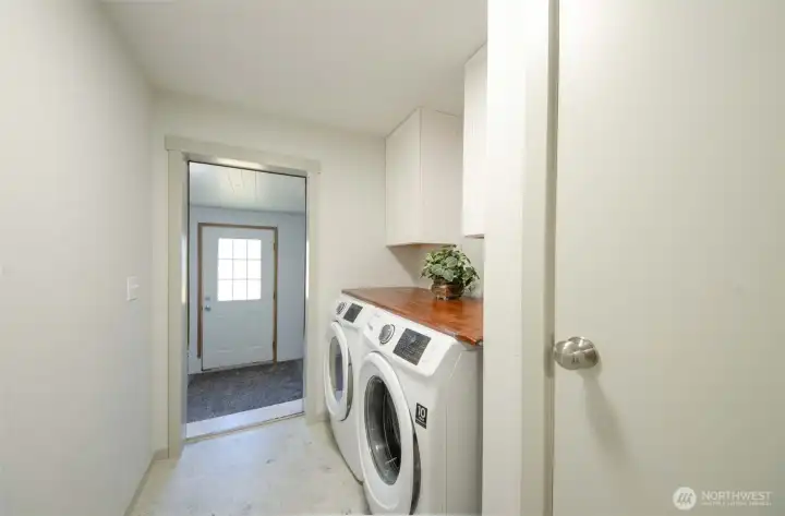 Laundry room with exterior storage area.