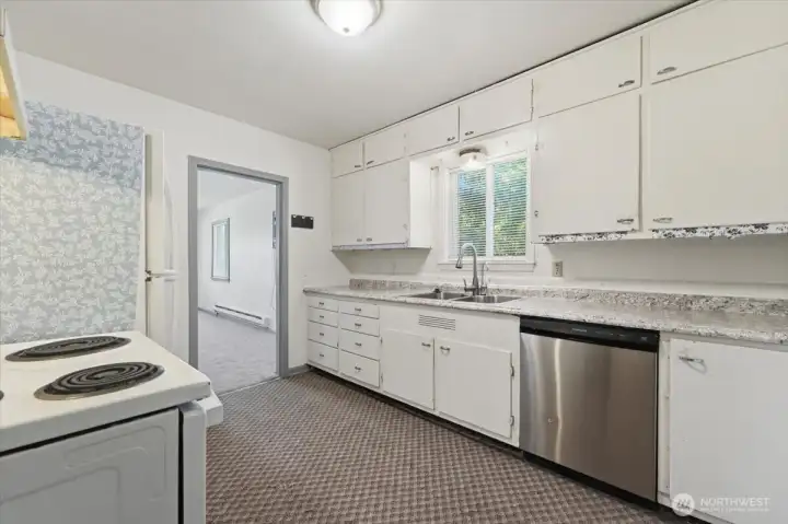 Kitchen with refrigerator, stove, dishwasher