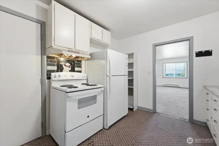 Kitchen with living room in the back