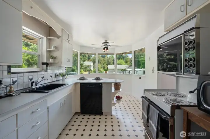 Plenty of cabinets for storage. Nice and bright with natural light from the large bay window.