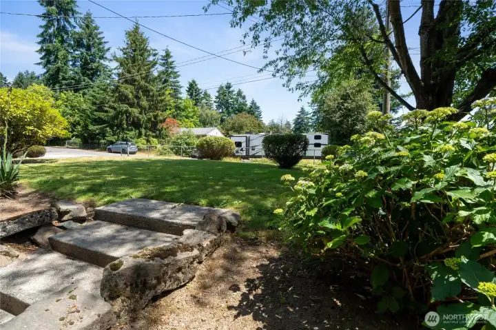 Stairs leading from the front yard to the back yard & patio with slider giving access to downstairs!