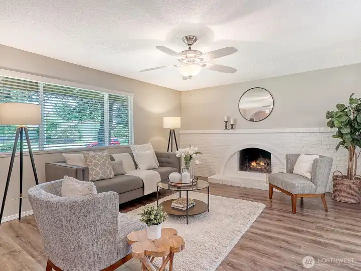Generous Living Room with charming, wood-burning fireplace!