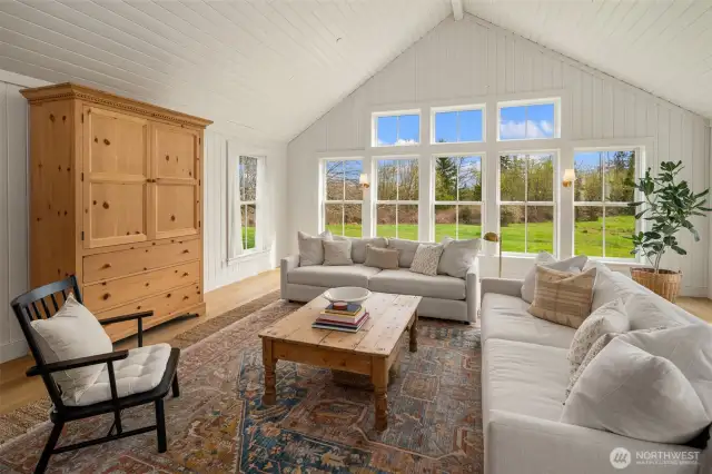 Elegance meets comfort—gather around the fireplace while enjoying seamless indoor-outdoor living through French doors.