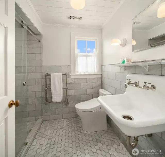 Upstairs bathroom is thoughtfully designed with elegant finishes and ample space, offering both style and functionality.