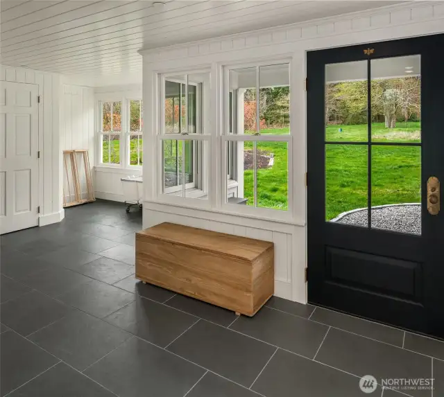 Designed for convenience—drop your boots, coats, and gear in this well-appointed mudroom.