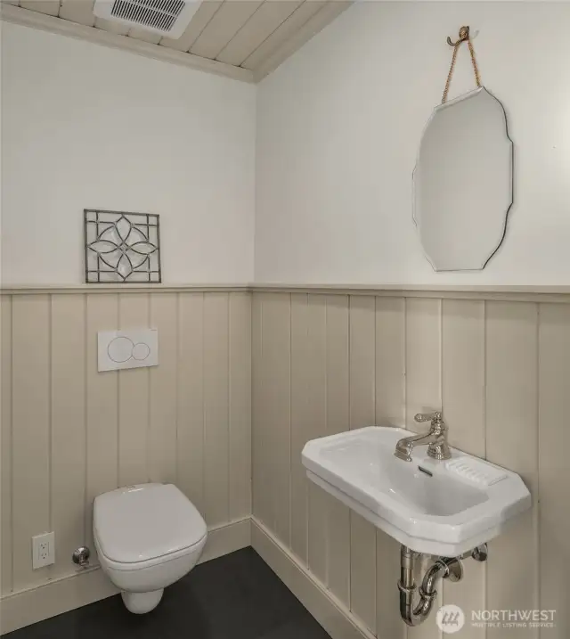 Small in size, big on style—an inviting powder room with exquisite details.