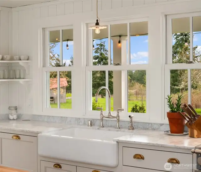 Enjoy breathtaking territorial views through large windows overlooking the yard and fruit trees.