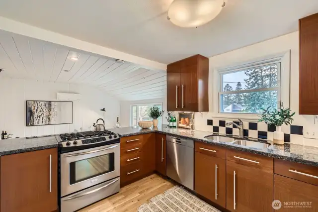 More kitchen with family/dining area beyond.