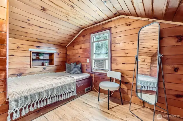 Charming upstairs bedroom with built-in bed platform.