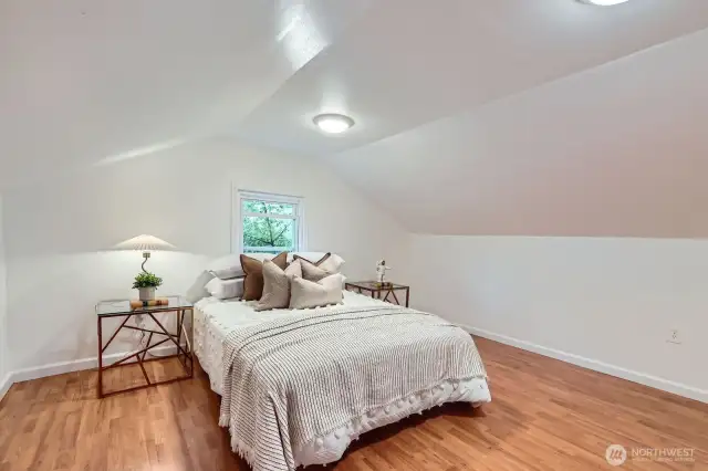 Lovely bonus space staged as what could be a fifth bedroom.