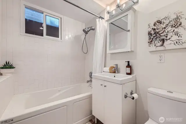 Lower level full bath adjacent to the 4th bedroom and family room. Heated Flooring!