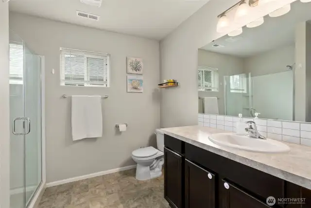 Beautiful primary bath is light and bright….