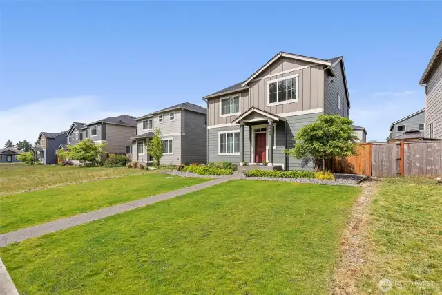 Here‘s another photo of the home on this wide street with sidewalks!