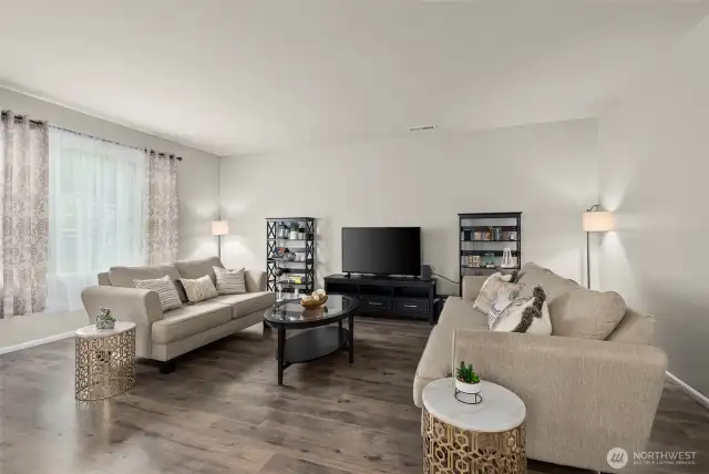 The expansive living room features a huge picture window…