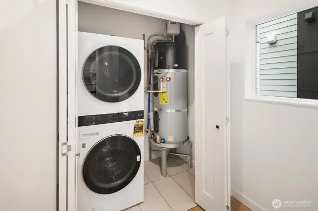 Home is equipped with a stacking washer/dryer.
