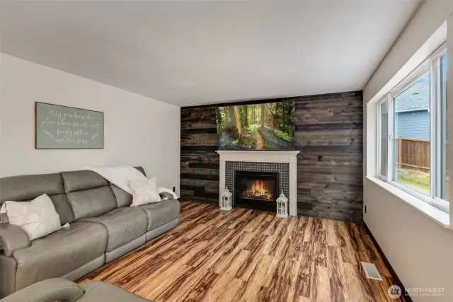 Inviting living room with gas fireplace and reclaimed wood wall