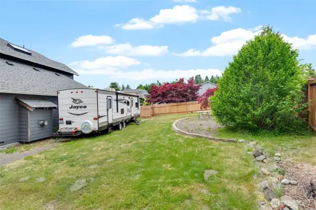 RV parking and side yard with gated fence