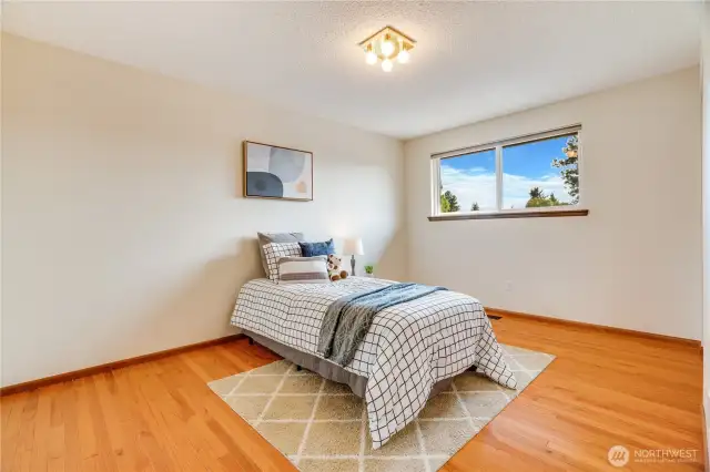 Oak floors continue into this 3rd bedroom at the end of the hall.