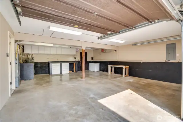 Turn right at the bottom of the stairs into this 589 square foot attached, 2-car garage with a storage room.