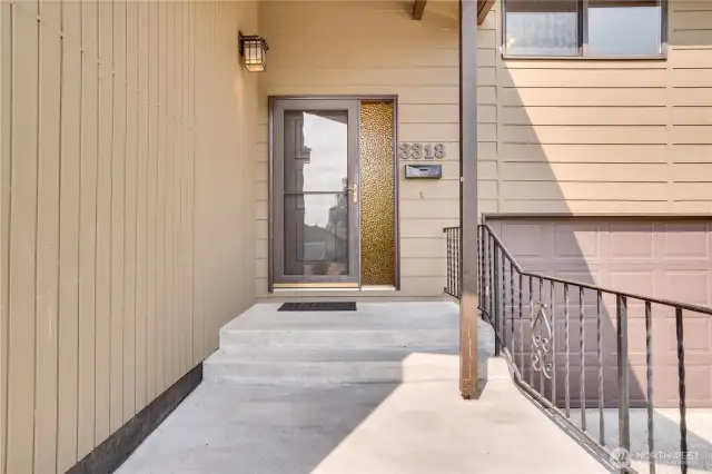 A covered entry and original sidelight welcome you and visitors home.