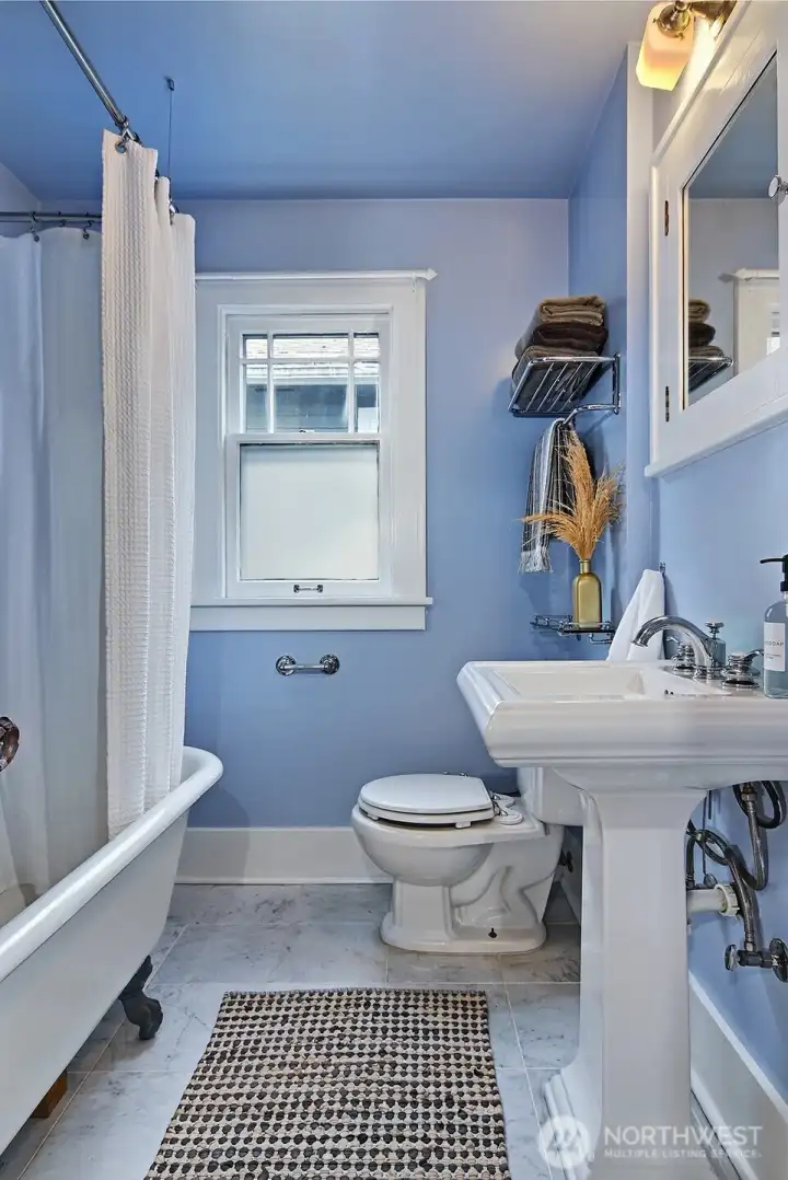 Main floor bathroom features a classic claw foot tub!