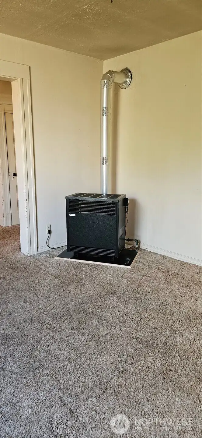 New gas furnace in living room is primary source of heat.