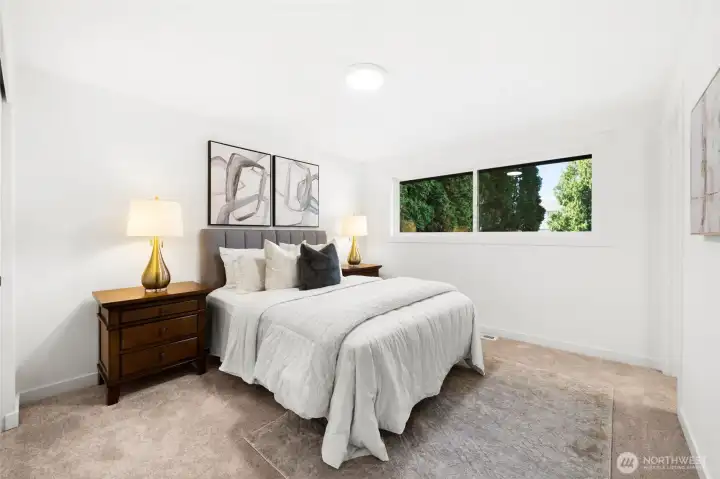 Primary bedroom boasts new carpet and attached primary bath
