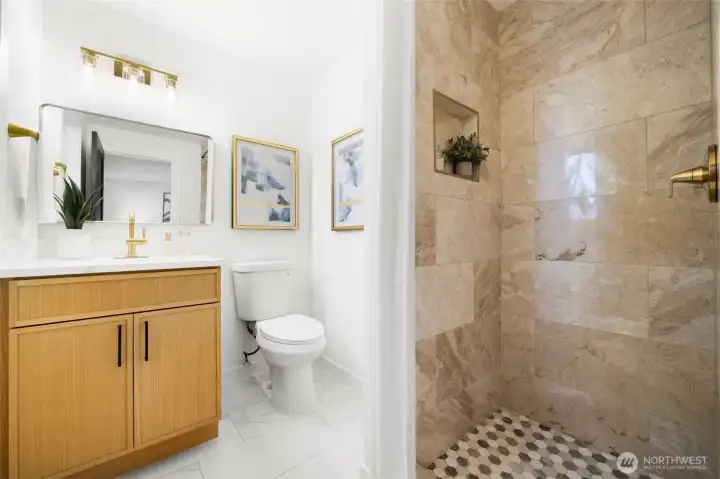 Primary 3/4 bath, new tile, new cabinets and counters