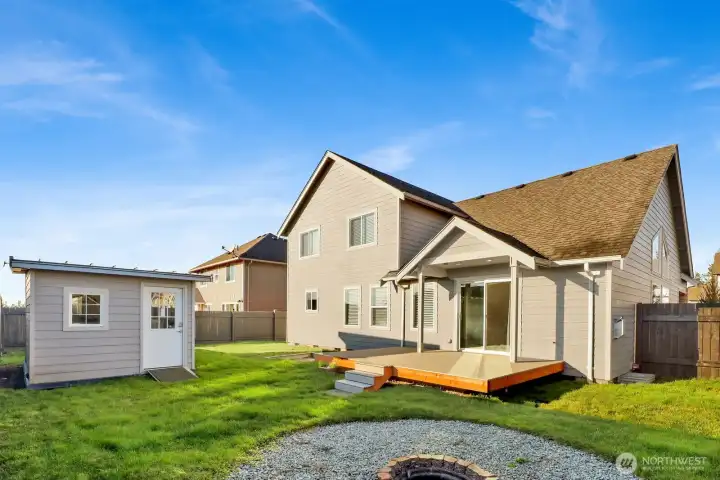 Spacious Bankcard with a Nice-Size Deck and Fire pit, perfect for Relaxing or Entreating! Handy Newer Shed for Storage or Hobbies.