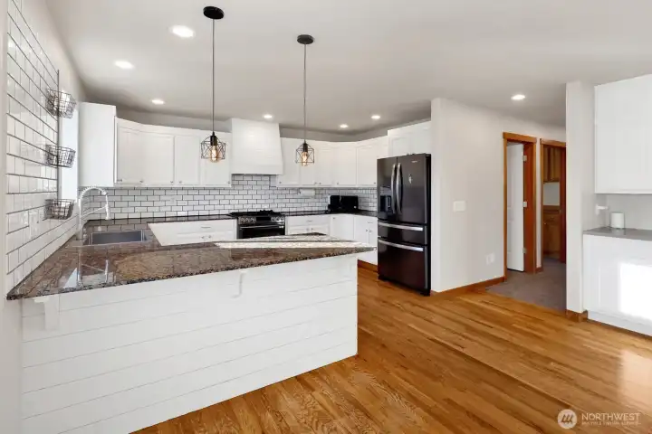 Updated kitchen (granite counter tops, tile backsplash and a large walk-in pantry),