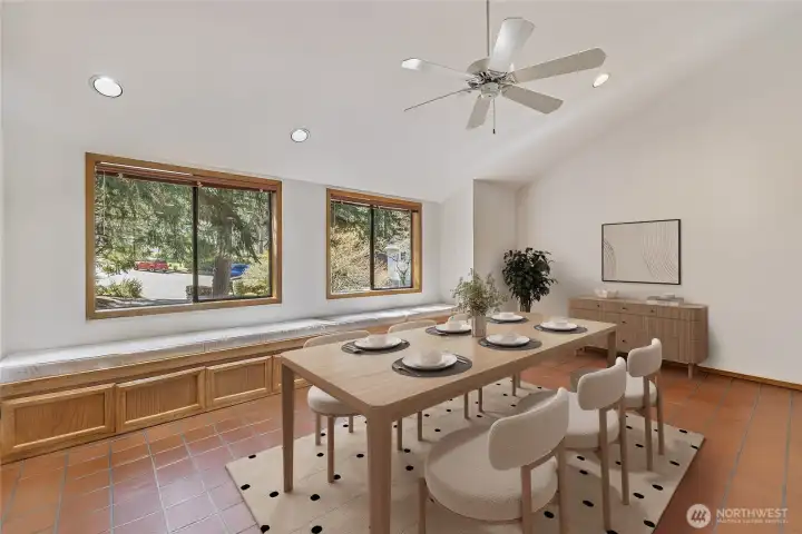 Staged eating area off the kitchen could be a second sitting room. with upholstered window seat