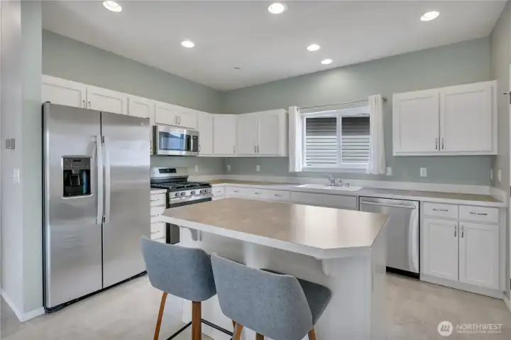 Kitchen with stainless steel appliances and center island.