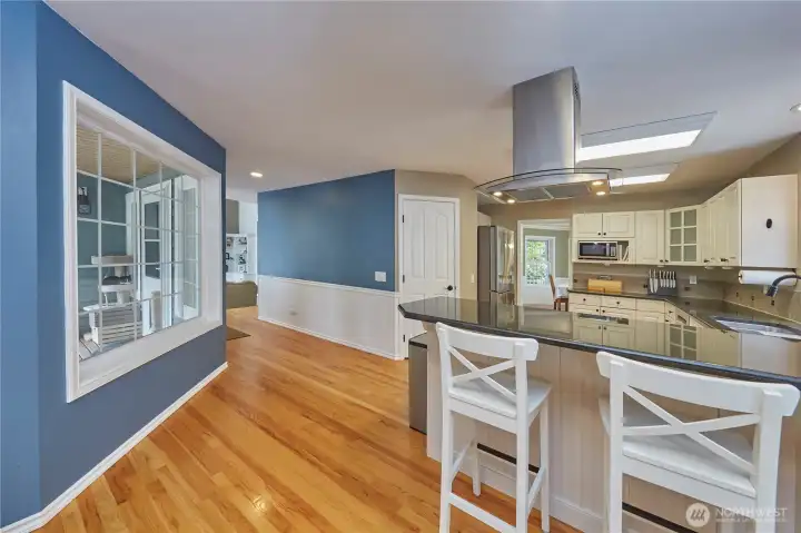 Kitchen looking towards living room on left and dining room on right.