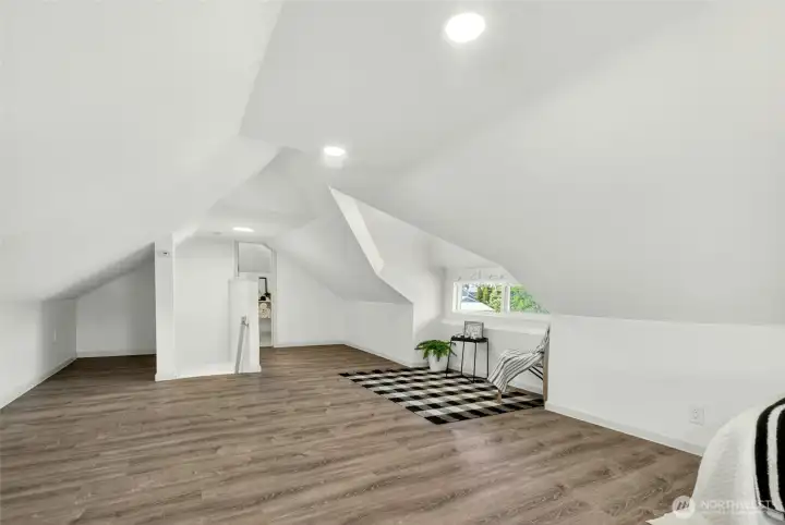 Large loft bedroom and 1/2 bath.