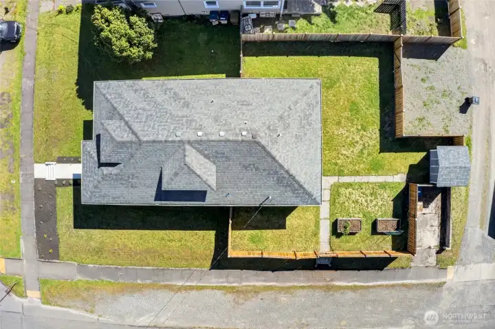 Aerial view of beautiful, fully updated, 4 bedroom, 2.5 bath on a corner lot with fenced yard.