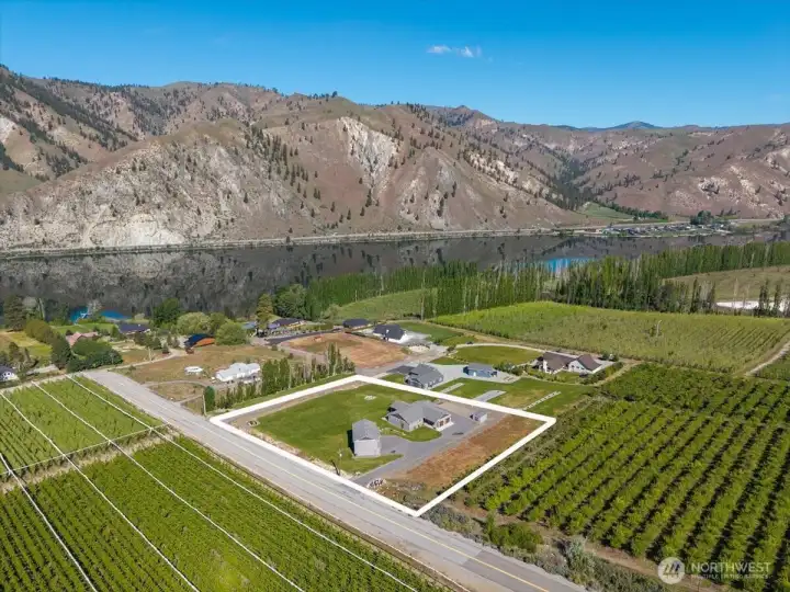 2.4 acre lot surrounded by orchards and steps away from the Columbia River