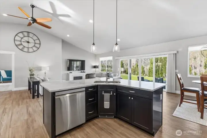 Open concept kitchen open to living & easy access to covered patio