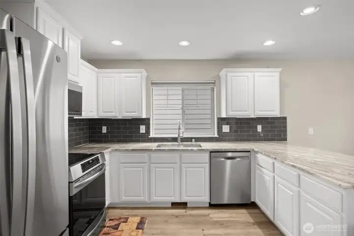 The stainless appliances are just 3 years old. The counters are quartz. The subway tile is timeless.