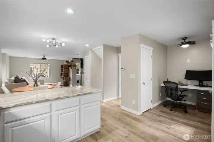 Off the kitchen is a nook for work-from-home or keeping organized. Don't miss the storage closet.