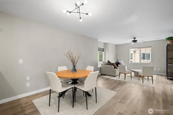 The dining room is spacious and offers updated lighting.