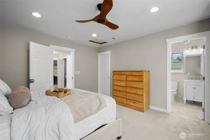 The primay bedroom looking towards the ensuite and walk-in closet.