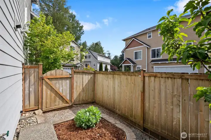 The gate allows for easy access to and from the front yard.