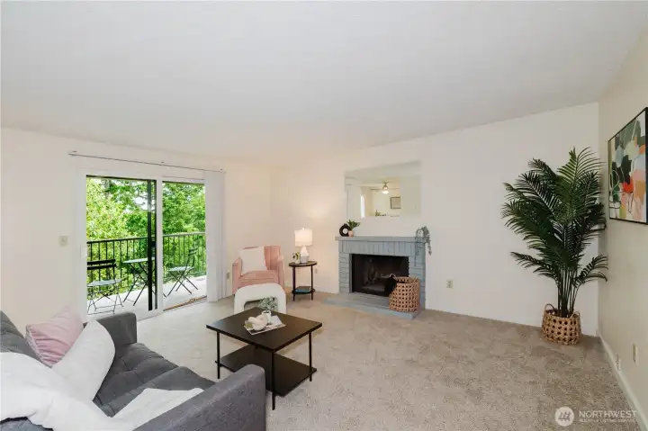 Spacious living room with wood burning fireplace Spacious living room with wood burning fireplace
