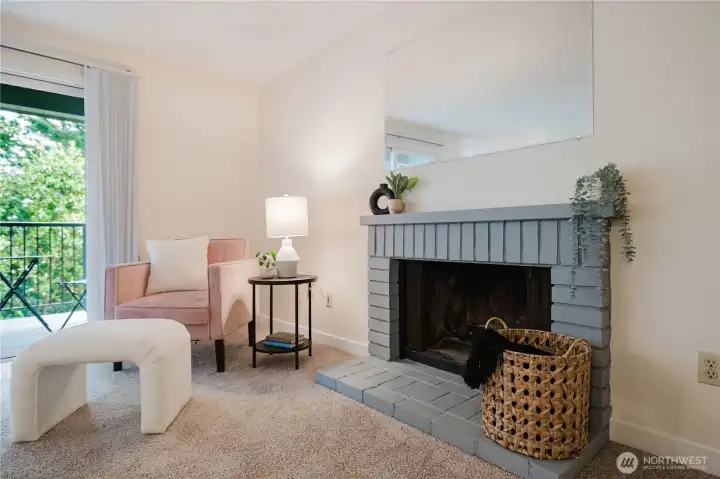Spacious living room with wood burning fireplace Spacious living room with wood burning fireplace
