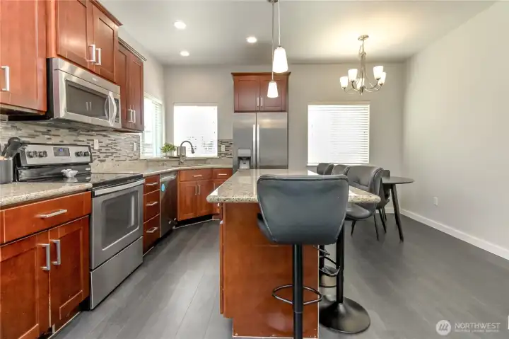 Roomy kitchen with center eating island and a nook in the back corner Roomy kitchen with center eating island and a nook in the back corner