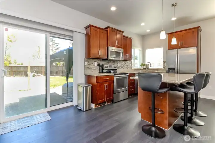 View of kitchen with doors to backyard and patio View of kitchen with doors to backyard and patio
